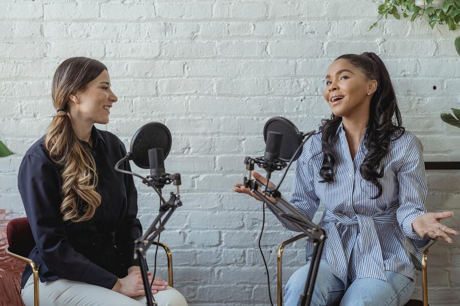 two women hosting a podcast