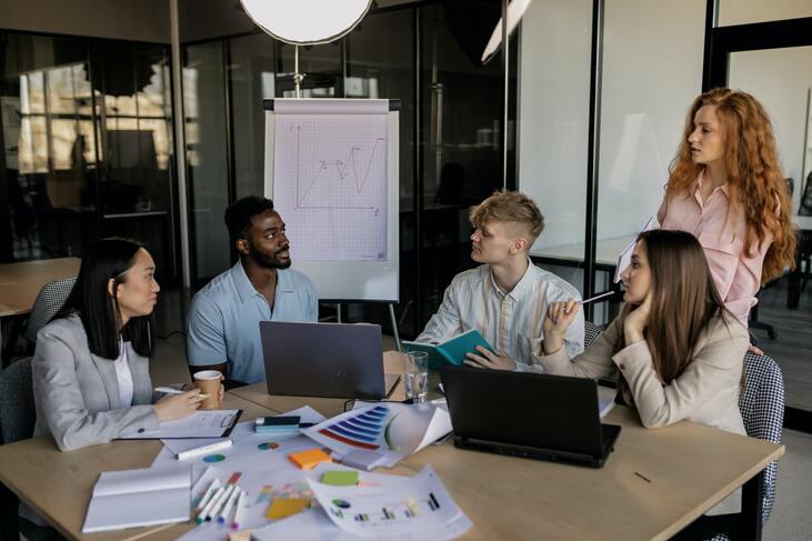 a diverse workplace holding a meeting