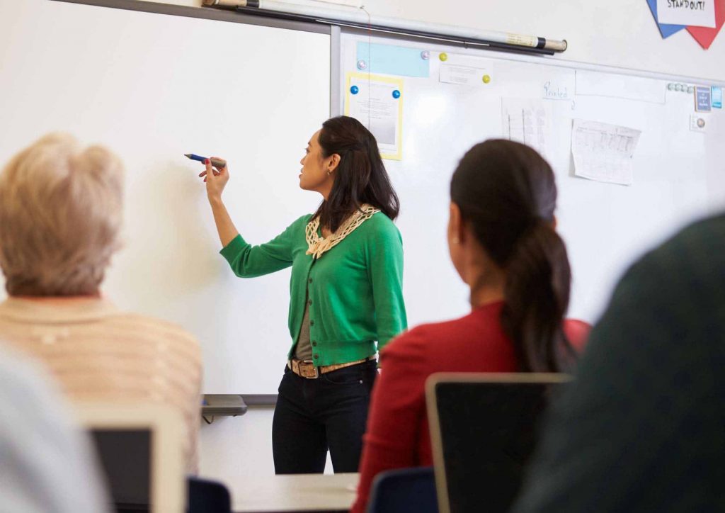 An image of a lady educating the workforce