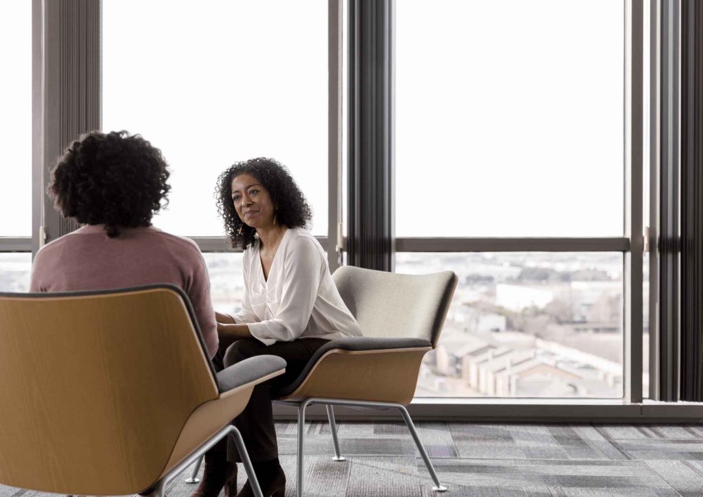 A picture of a employer helping with employee financial wellbeing