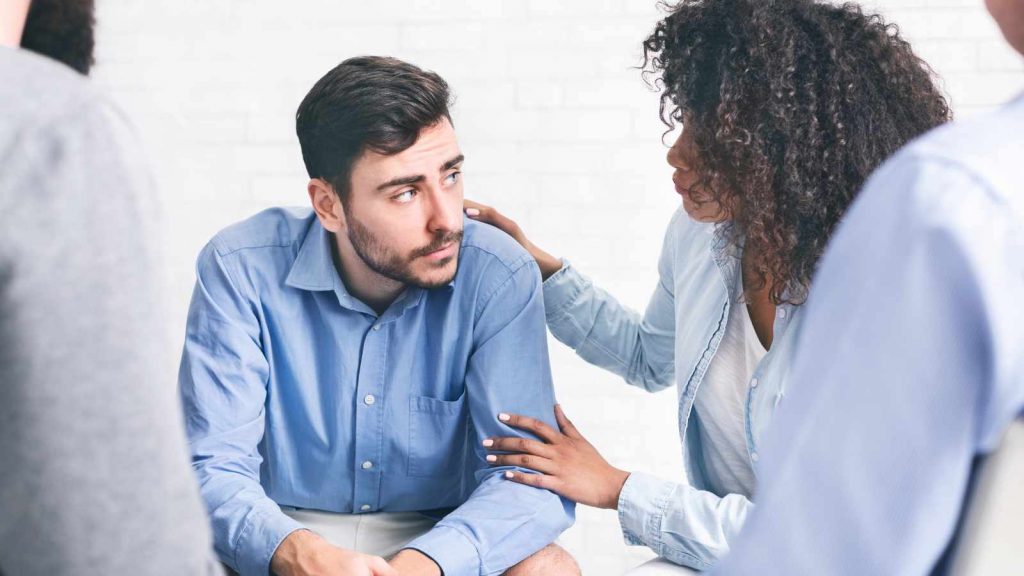 An image of an employer supporting an employee with their stress